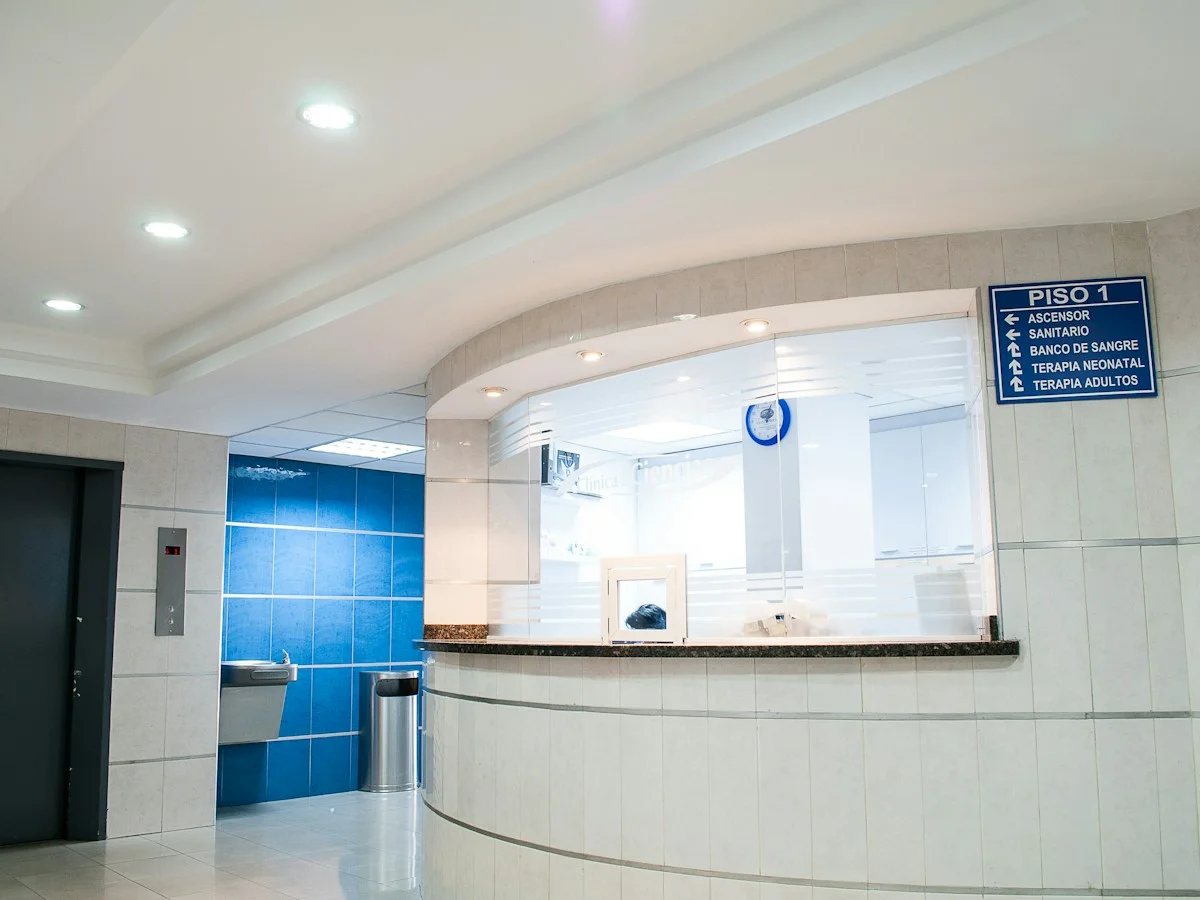 A curved reception desk in a bright medical clinic