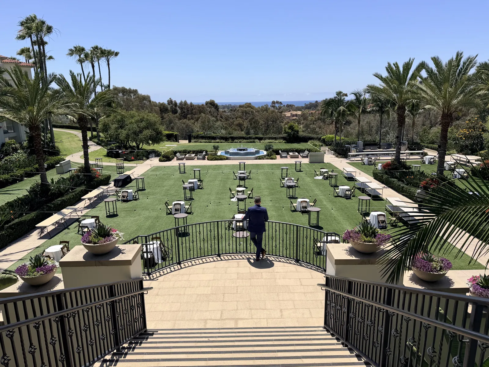 Outdoor event lawn at a healthcare leaders summit venue overlooking the Pacific coast