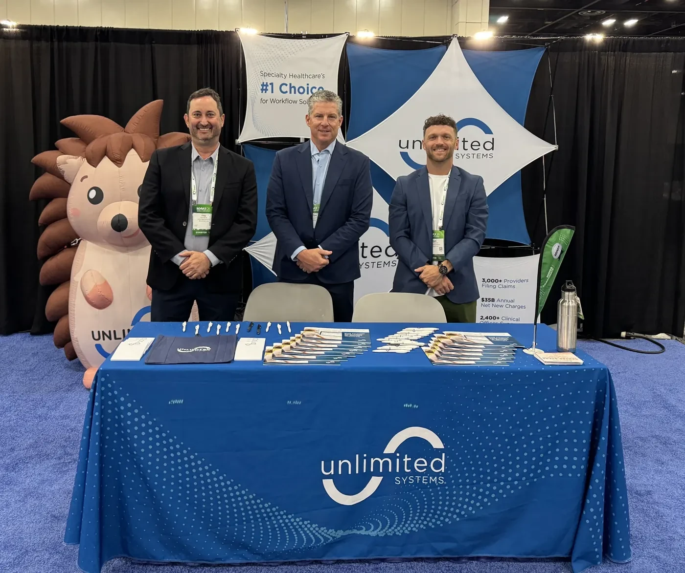 The Unlimited Systems RCM software team at the company's booth at the MGMA 2026 annual conference