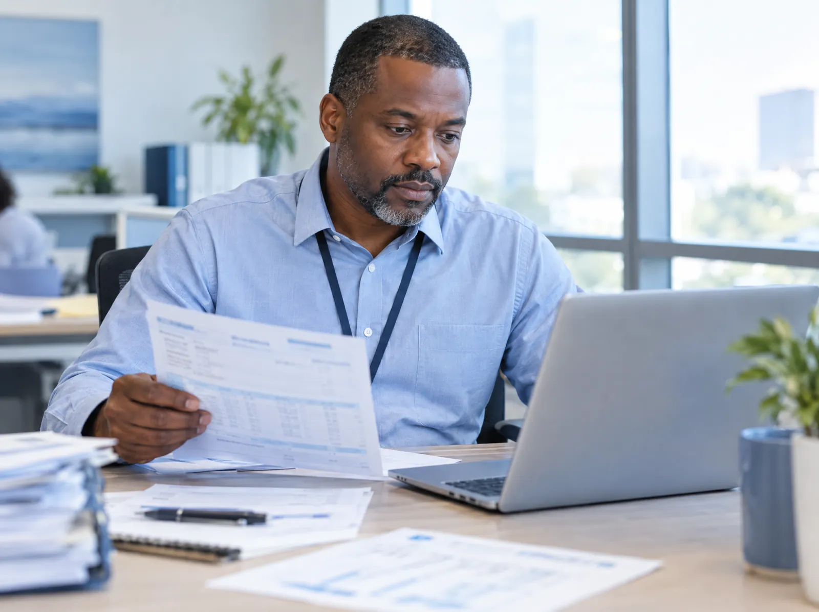 Payment posting software in use: a revenue cycle specialist reconciling insurance remittances against payments