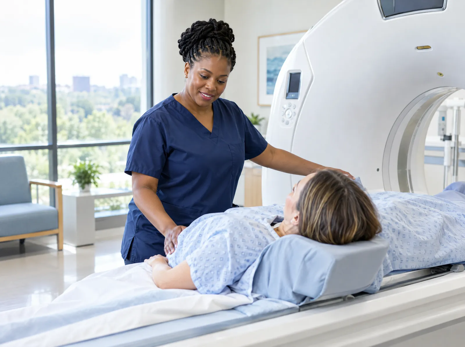 RCM software for Imaging Centers: CT technologist guiding a patient onto a scanner in an outpatient imaging center